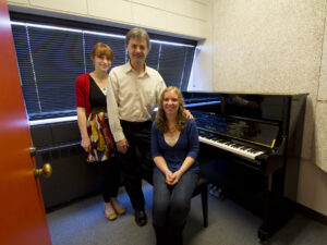 Piano professor Dr. Nicholas Roth  and students