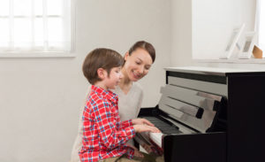 Mother and Child Playing Piano
